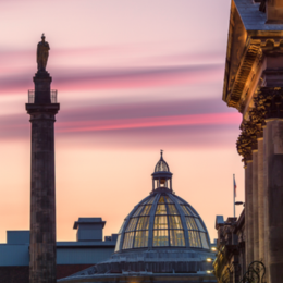 Monument and Theatre Royal at sunset