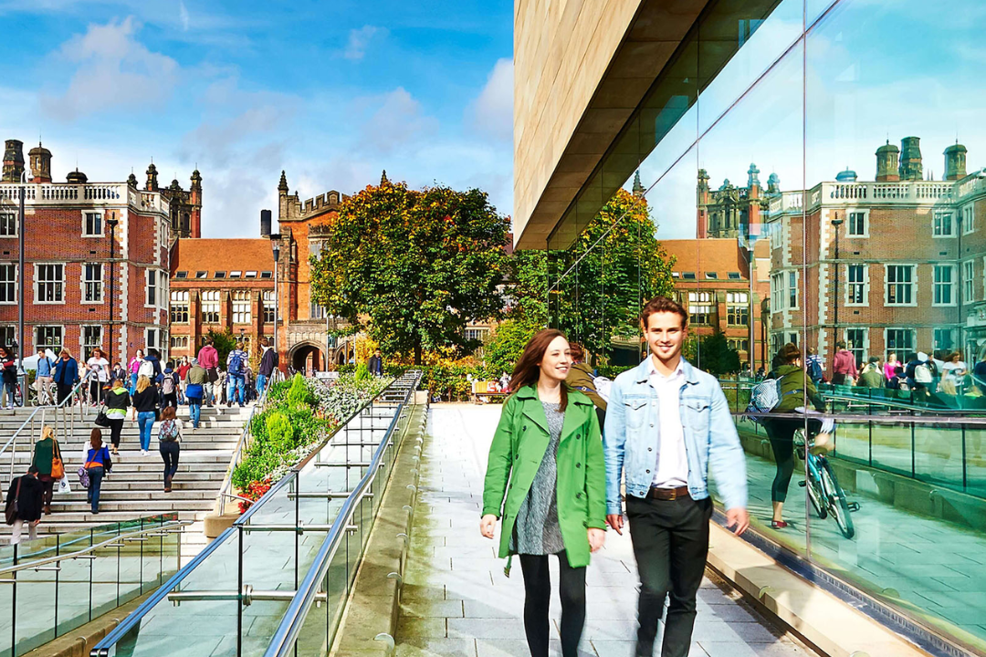 Students walking past King's Gate on campus 