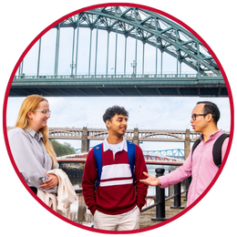 Students standing on the Quayside with the bridges behind