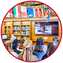 Students watching a film in the Language centre with flag bunting above