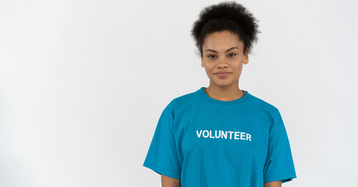 Teenage girl wearing volunteer t-shirt