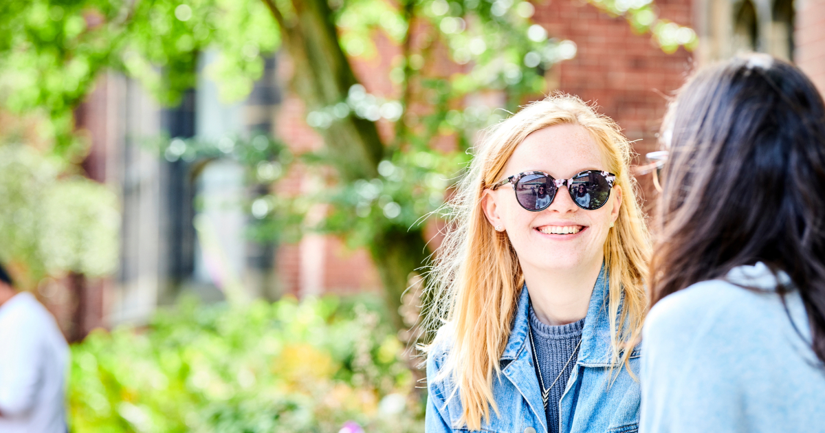 student-smiling-wearing-sunglasses