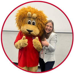 Dr Yvonne Chase with Percy the lion 